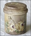 Covered jar decorated with flowers